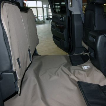 Closeup view of gray seat and floor liner on Chrevrolet pickup truck
